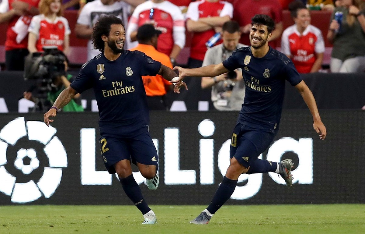 Asensio và Marcelo ăn mừng sau pha phối hợp ghi bàn đẹp mắt. (Nguồn: Getty Images)