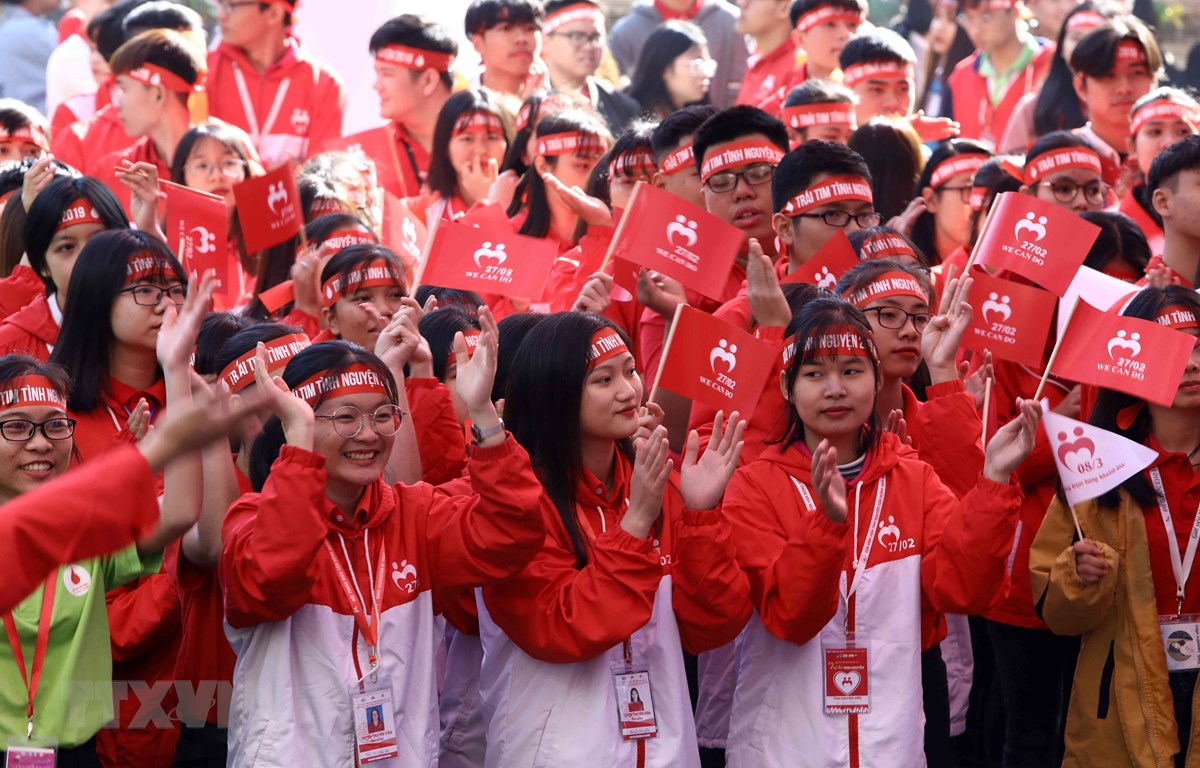 Các tình nguyên viên cùng lan tỏa tinh thần "Tình nguyện vì một tương lai hòa nhập." (Ảnh: Văn Điệp/TTXVN)